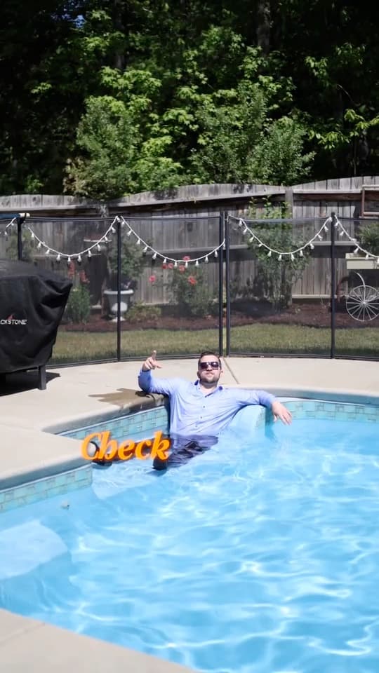 Lifestyle real estate video still by the pool
